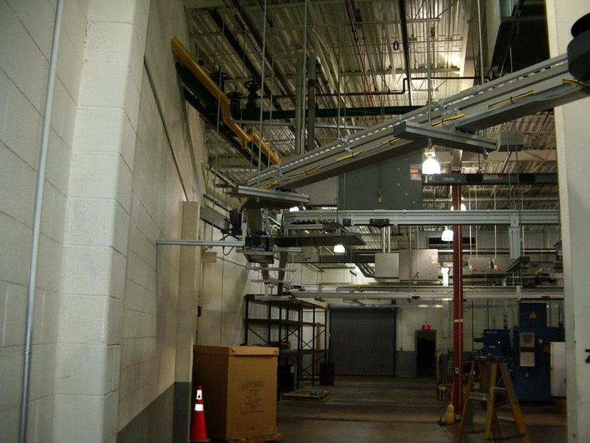 Overhead FlexLink conveyor system installation in industrial facility — Anton Installers Inc. Pennsylvania